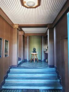 a hallway with stairs with a table in the middle at L'Anfora in Montesilvano +10 photos