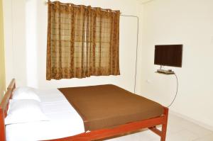 Кровать или кровати в номере Vega Residency