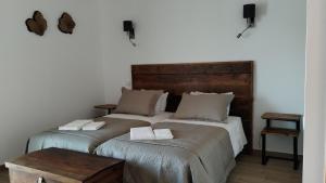Cama ou camas em um quarto em Quinta do Oratório Agroturismo