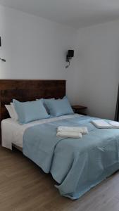 Cama ou camas em um quarto em Quinta do Oratório Agroturismo