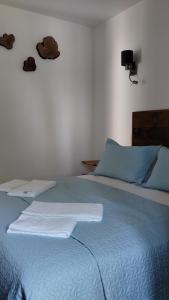 Cama ou camas em um quarto em Quinta do Oratório Agroturismo