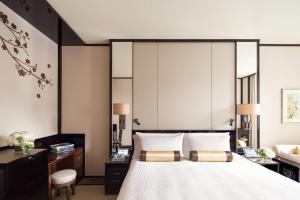 Letto o letti in una camera di The Peninsula Hong Kong