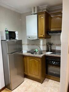Kuchyň nebo kuchyňský kout v ubytování Acogedor apartamento en Gijón , VUT1020AS + 7 fotografií