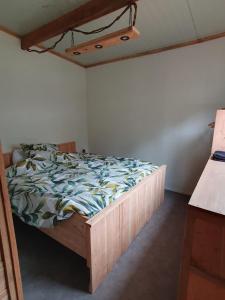 Postel nebo postele na pokoji v ubytování Natuurchalet de Das