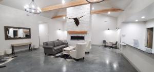 a living room with a couch and a fireplace at Longhorn Flats in Loving