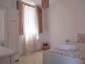 A bed or beds in a room at La casita
