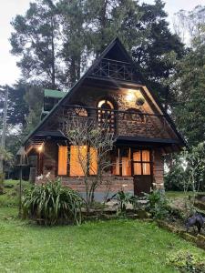 a small house with a gambrel roof at Tiny Chalet in the clouds in Medellín
