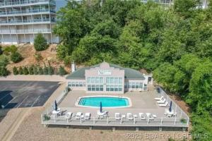 an aerial view of a building with a swimming pool at Rare GEM @Emerald Bay - Smart Home - THAT VIEW!!! in Lake Ozark
