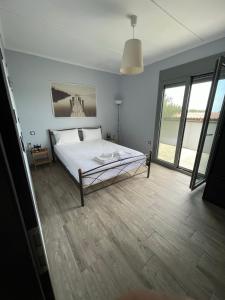 Postel nebo postele na pokoji v ubytování Ambelakia Bungalow