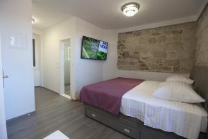 Postel nebo postele na pokoji v ubytování Villa Kate