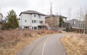 a winding road in front of a house at Royal highland livingroom bedroom suite in Calgary