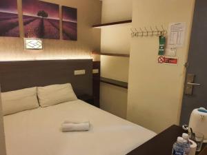 Letto o letti in una camera di One Point Hotel