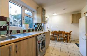 a kitchen with a sink and a dishwasher at 3Bed house near Nottingham city centre in Nottingham