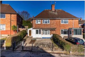 a brick house with a car parked in front of it at 3Bed house near Nottingham city centre in Nottingham