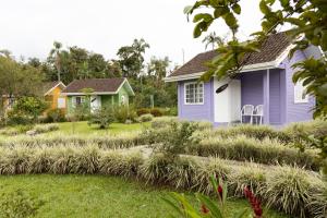 a house with a garden with tall grass at Pura Vida Residence in Morretes