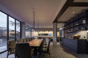 a large dining room with a long table and chairs at sevenoaks in Cloppenburg