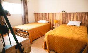 En eller flere senge i et værelse på Villa Le Colonial Zen - T4 à 5 mn Aéroport