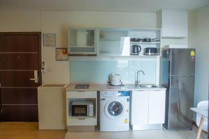 Kuchyň nebo kuchyňský kout v ubytování Lovely 1-Bedroom condo near Night Barzaar