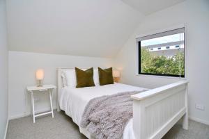 Voodi või voodid majutusasutuse Dickens St - Christchurch Holiday Homes toas