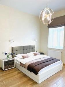 En eller flere senge i et værelse på Apartment ЖД вокзал, Центр + 25 billeder