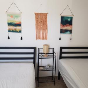 two beds sitting next to each other in a bedroom at Baja's Rest Stop in San Felipe +17 photos