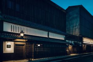 a building with a light on the side of it at THE HIRAMATSU KYOTO in Kyoto
