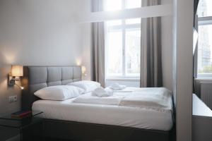 Cama o camas de una habitación en KH Apartments Universitaet