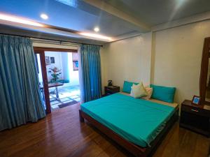 Katil atau katil-katil dalam bilik di Rose Villas Resort