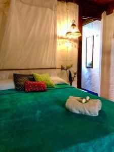 Voodi või voodid majutusasutuse Hostal Los Orishas toas