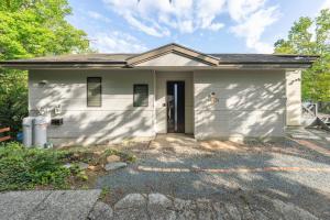 a small white house with a garage at YAMO-Kawana Ippekiko in Ogi