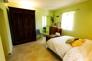 Postel nebo postele na pokoji v ubytování Cascina Canale