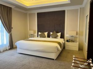 Voodi või voodid majutusasutuse Remaj Hotel toas