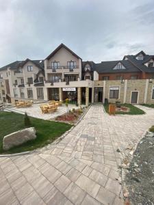 a large building with a patio in front of it at Apartman BIG Milmari S19 in Kopaonik
