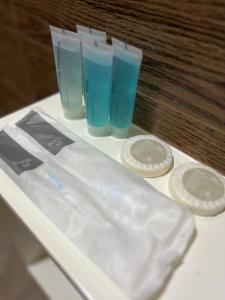 a group of three plastic cups sitting on a counter at Rufana Suites in Moalboal