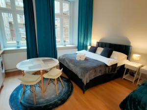 Postel nebo postele na pokoji v ubytování Hugo Eden Apartments
