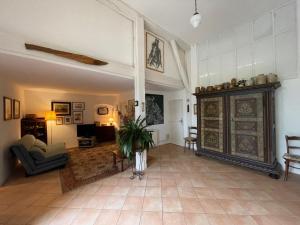 a large living room with a couch and a table at Appartement près de DOLE in Menotey