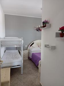 A bed or beds in a room at Vacanze in Sicilia
