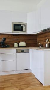 Kuchyňa alebo kuchynka v ubytovaní Comfortable Apartments Vienna 1100 with contactless Check-in