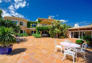 a patio with a table and chairs in front of a house at Xenofilia 3 in Moraira