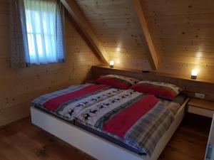 Postel nebo postele na pokoji v ubytování Premiumalmhütte Wiedhupf