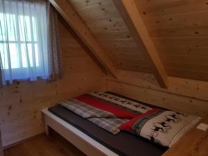 Postel nebo postele na pokoji v ubytování Premiumalmhütte Wiedhupf