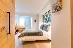 Łóżko lub łóżka w pokoju w obiekcie Hotel Flachauerhof