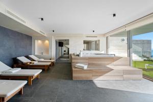 a living room with couches and a bath tub at Seaview villa with Wellness, Dreams Of Dalmatia II in Baška Voda +47 photos