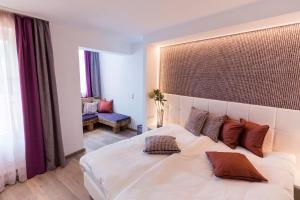 Łóżko lub łóżka w pokoju w obiekcie Hotel Flachauerhof