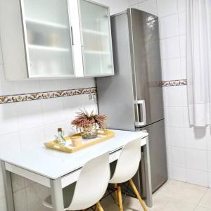 Kuchyň nebo kuchyňský kout v ubytování Piso Riazor 4 habitaciones