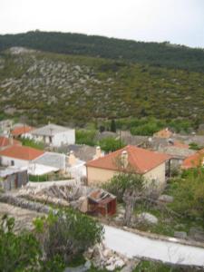 a small town with houses and a mountain at Stelios house in Theológos