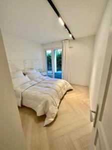 Posteľ alebo postele v izbe v ubytovaní CAM0 - appartement 2 chambres en rez-de-terrasse