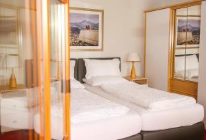 Posteľ alebo postele v izbe v ubytovaní Hotel Sonnenhof - bed & breakfast & appartements