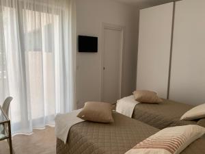 Postel nebo postele na pokoji v ubytování Villa Pasquy