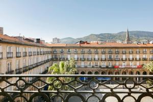 a view of a building from a balcony at Habitaciones en la Plaza Nueva in Bilbao